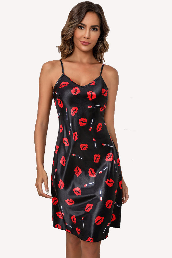 Black satin slip dress with red lips and small graphic accents, spaghetti straps, V-neck