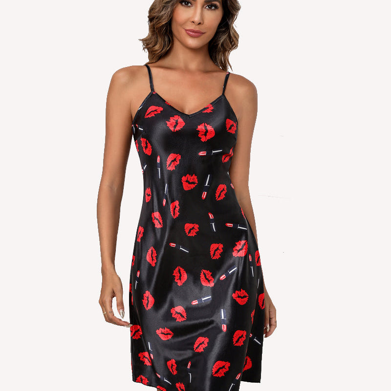 Black satin slip dress with red lips and small graphic accents, spaghetti straps, V-neck