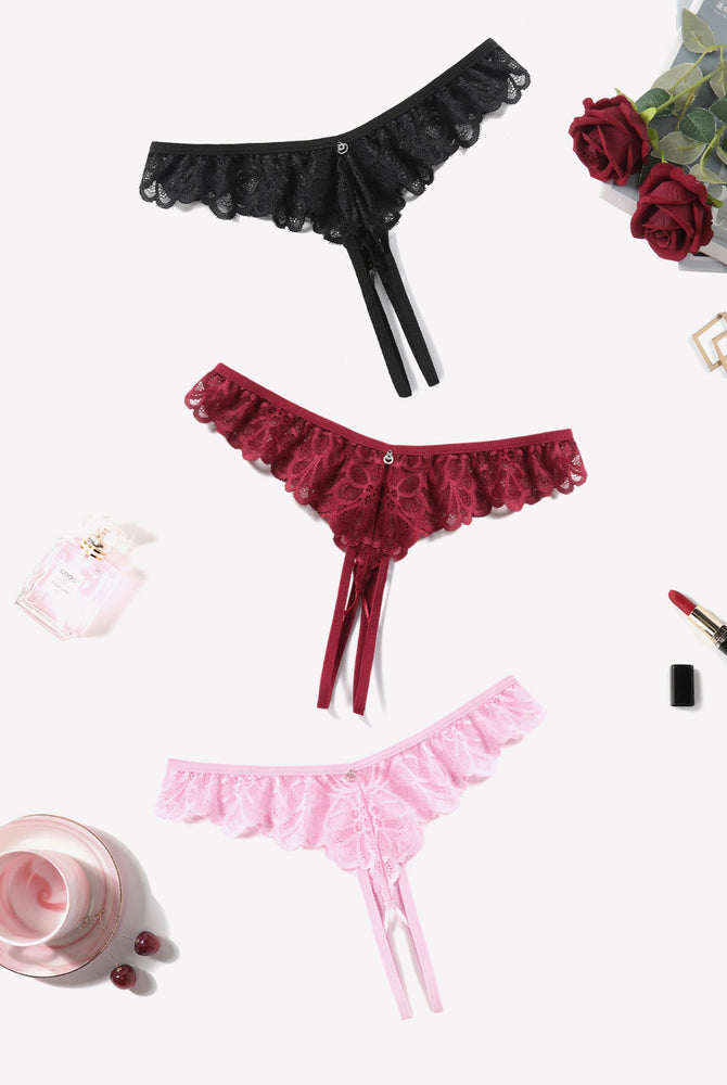 Lace thong briefs in black, wine red, and light pink with scalloped lace edges