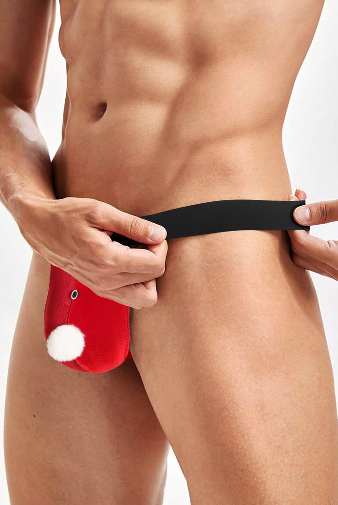 Red Santa g-string thong being adjusted, black waistband and white pom-pom