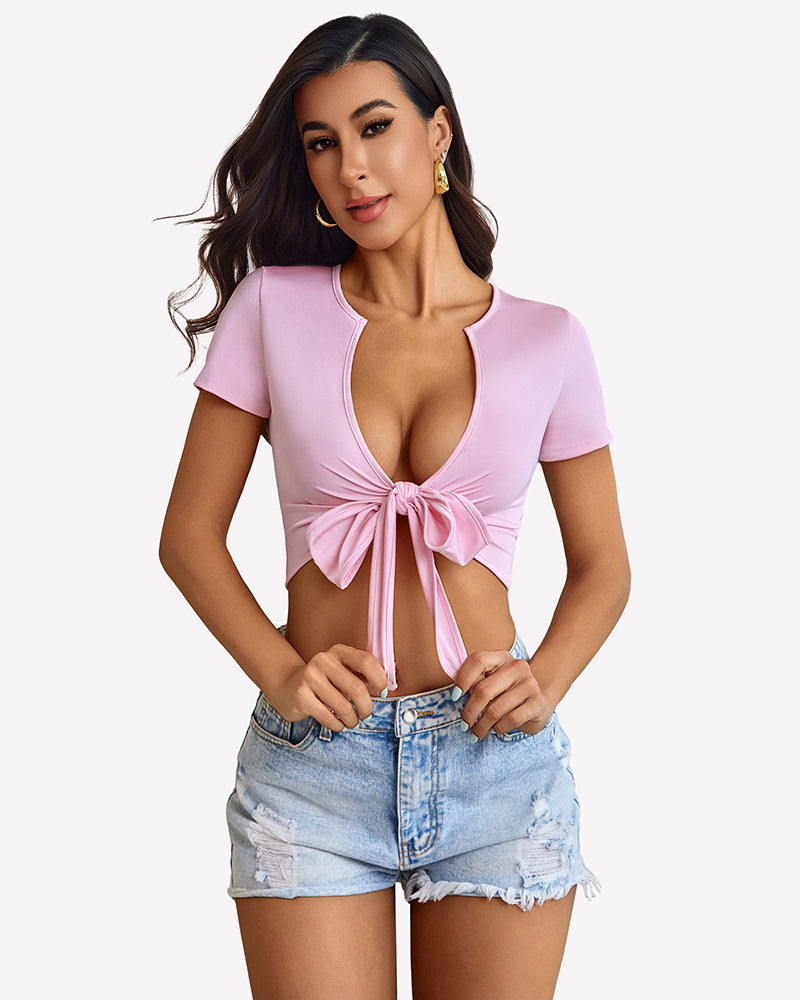 Light pink tie-front crop top with short sleeves and V-neckline tie