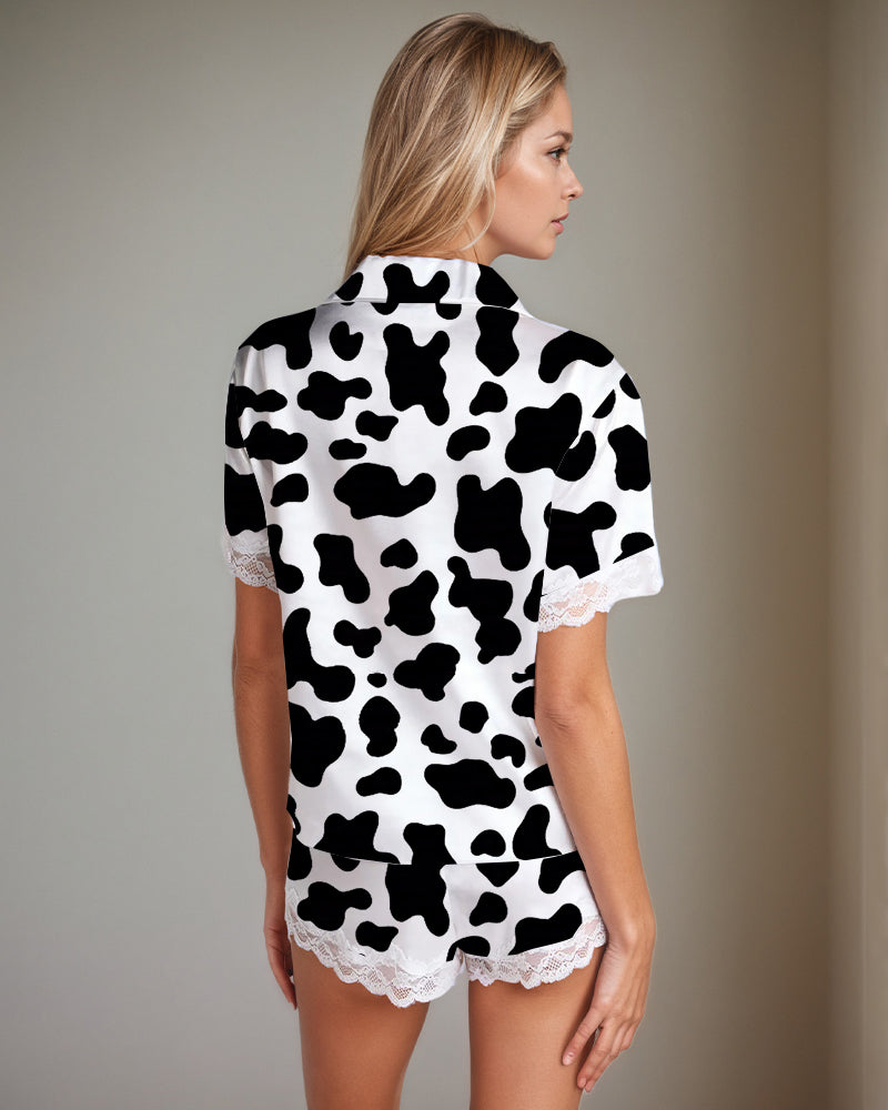 Satin pajama set, cow print short-sleeve top and lace-trim shorts, back view, white/black
