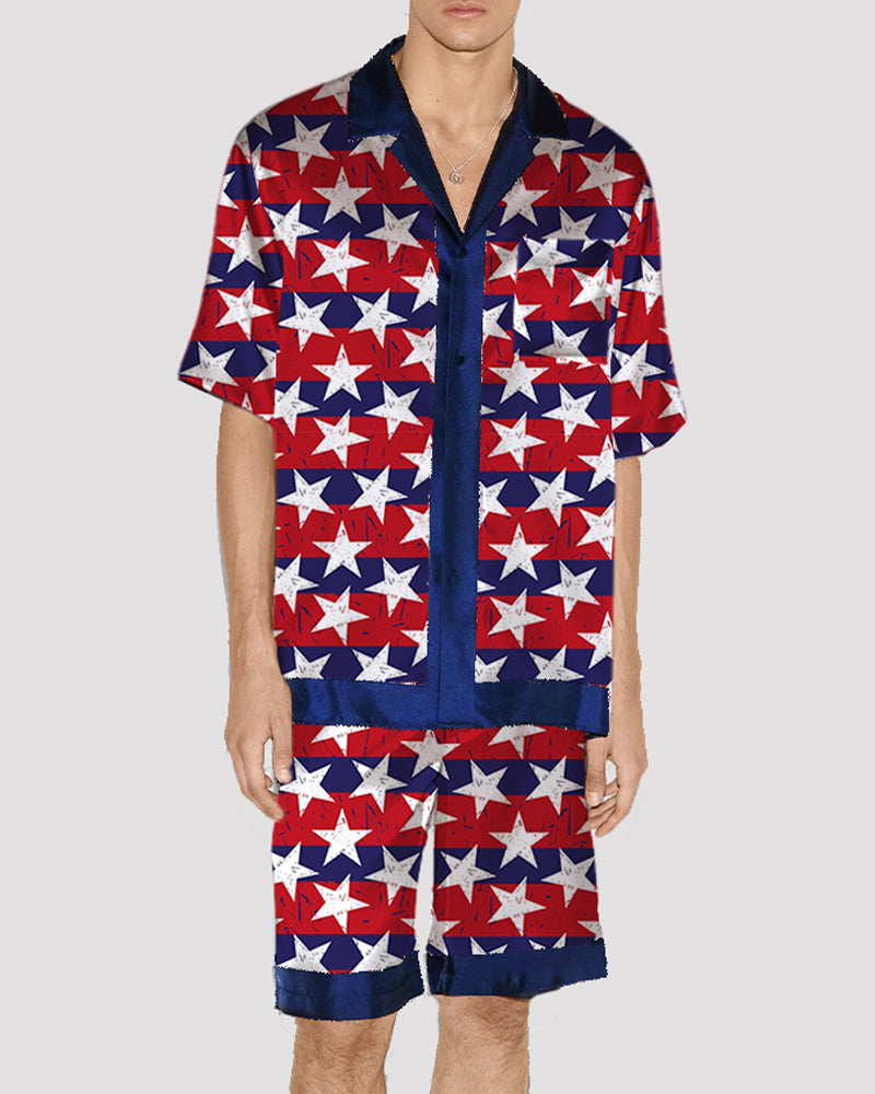 Men's satin pajama set with red, white, and blue star pattern, button-up shirt and shorts