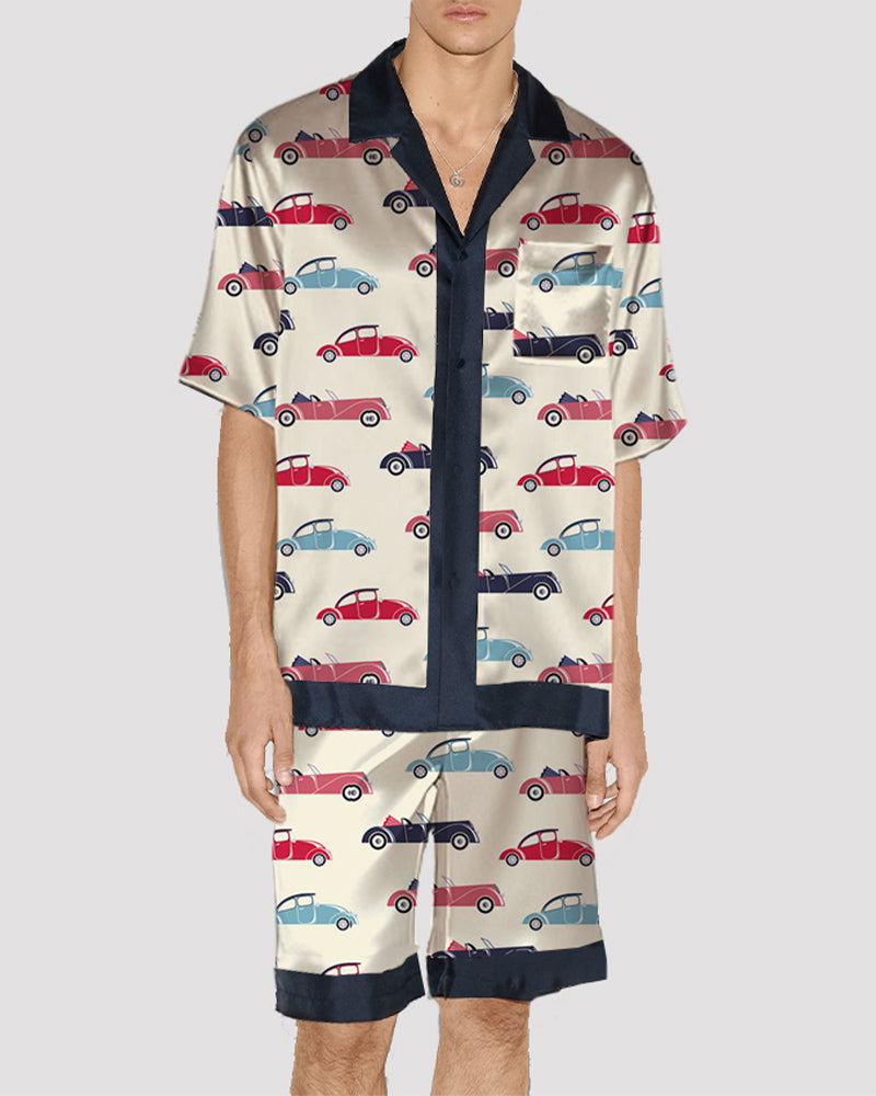 Men's satin pajama set with colorful car print, short-sleeve button-up and shorts