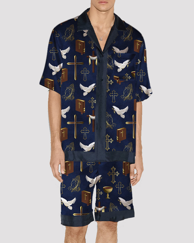 Men's satin pajama set with navy cross and dove print, button-up shirt and shorts