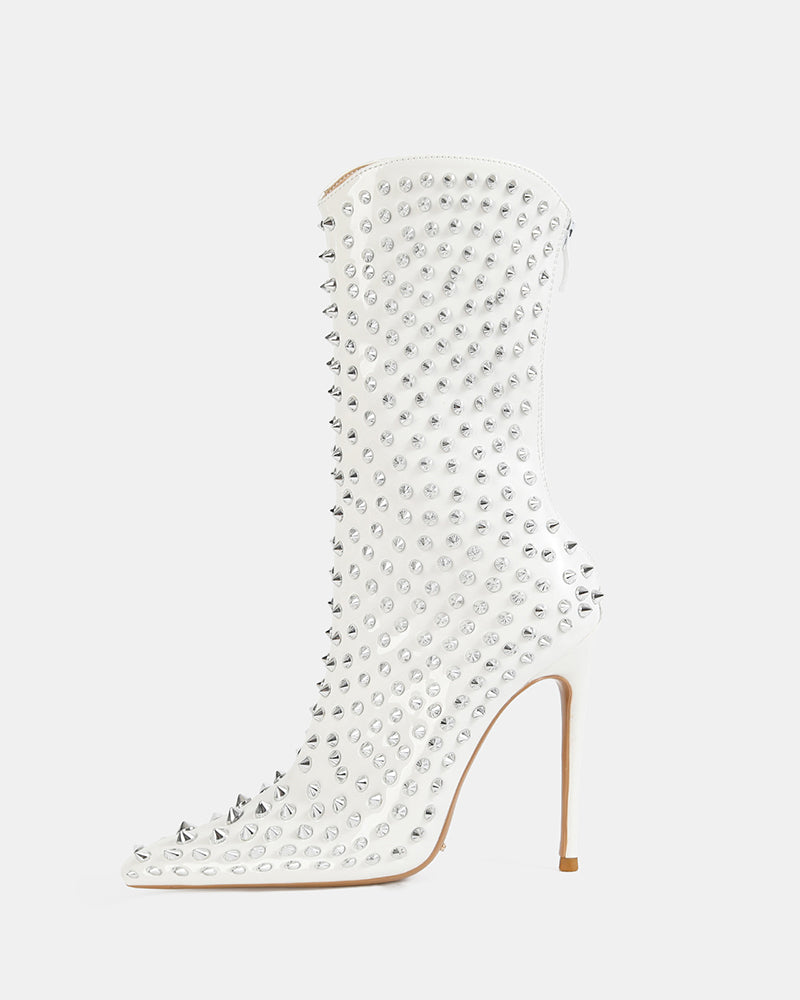 White mid-calf stiletto boot with pointed toe and silver spike studs