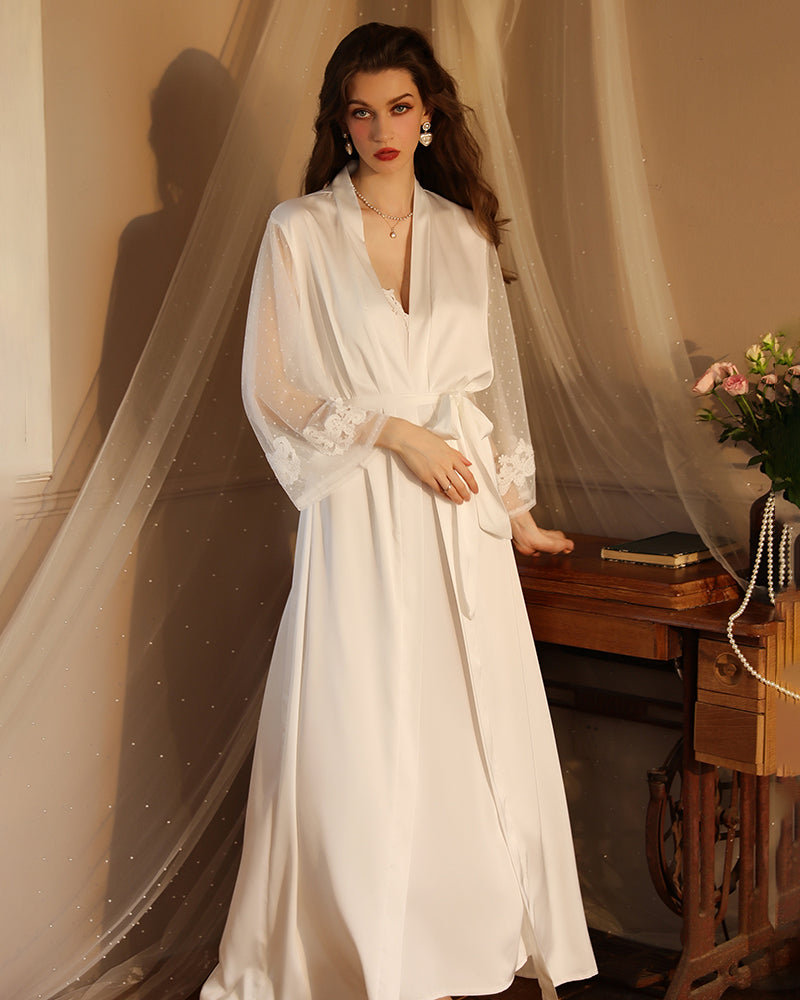White satin night robe with V neckline, lace sleeves, and ribbon-tied waist belt