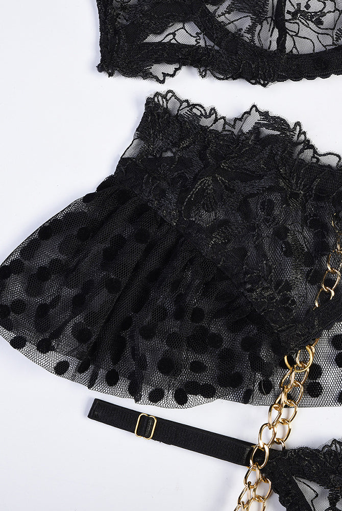 Black lace lingerie garter with polka-dot tulle skirt and gold-tone chains