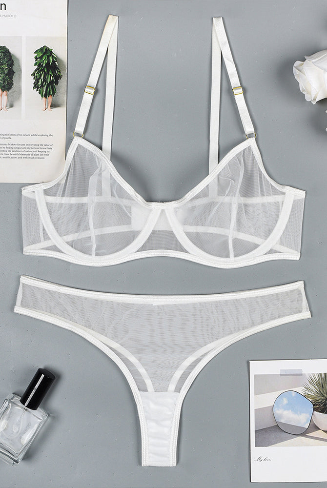 White sheer mesh underwire bra and thong panty set, flat lay