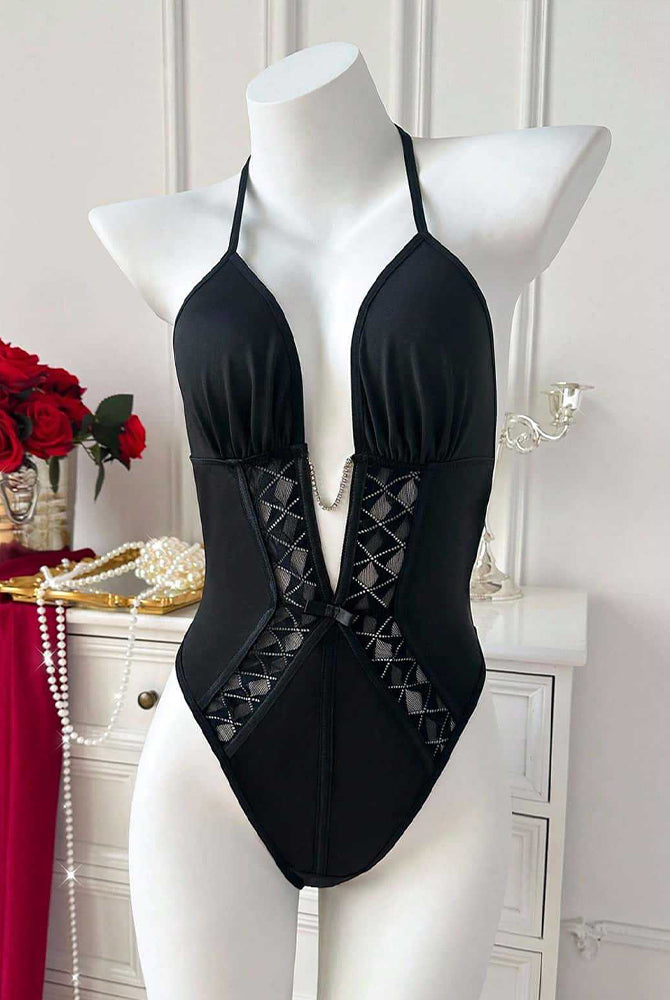Black halter-neck bodysuit on mannequin with deep V front and lattice insert