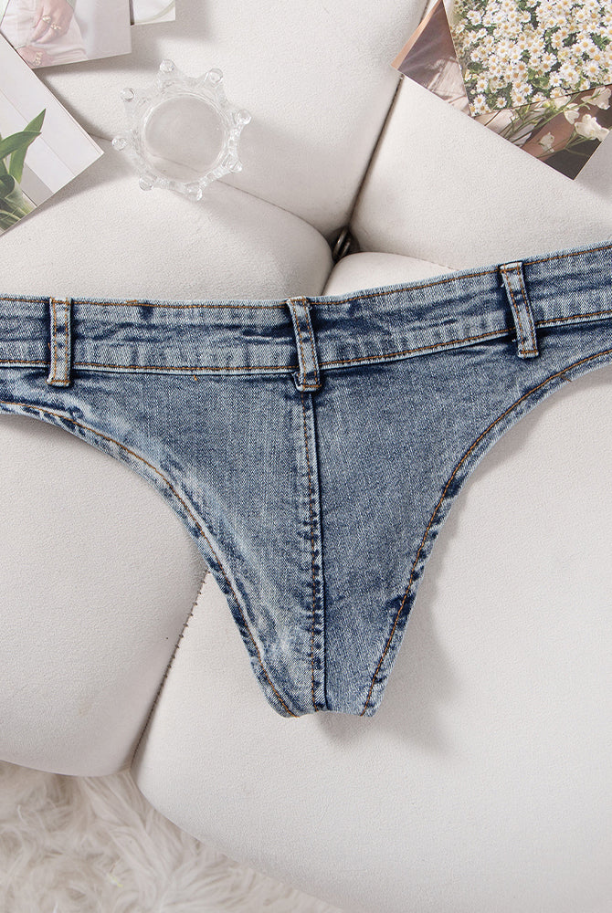 Light blue denim thong low-rise panties with belt loops and button fly detail.