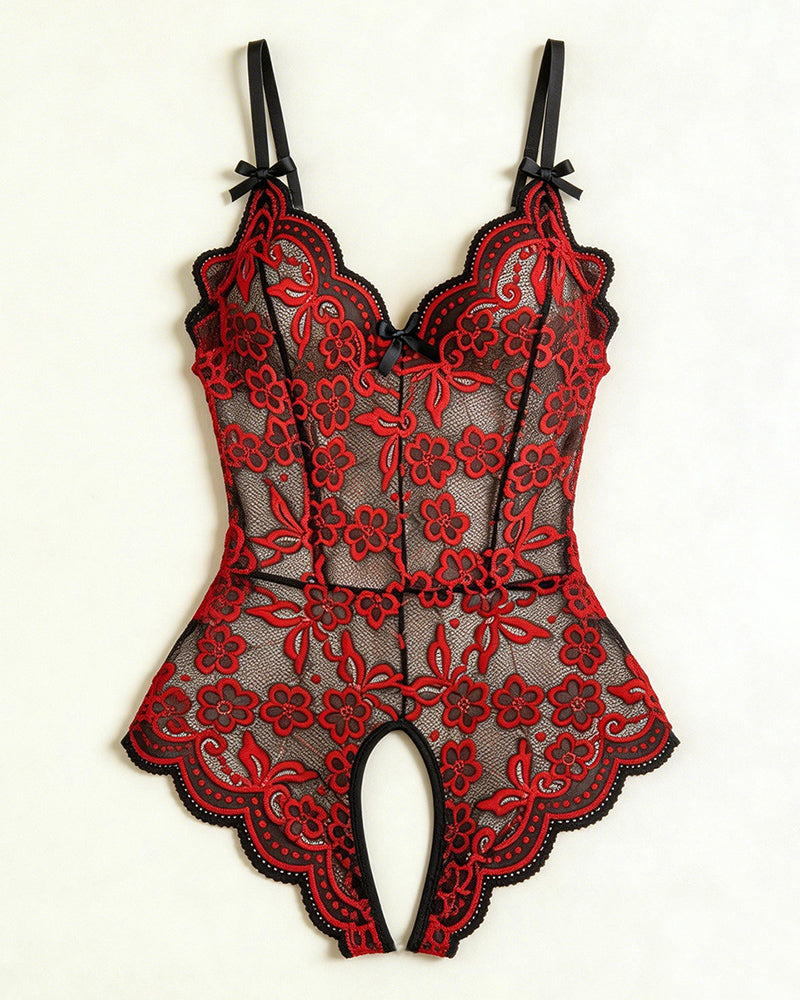 Flat-lay red and black floral lace crotchless teddy with V-neck and bow straps.