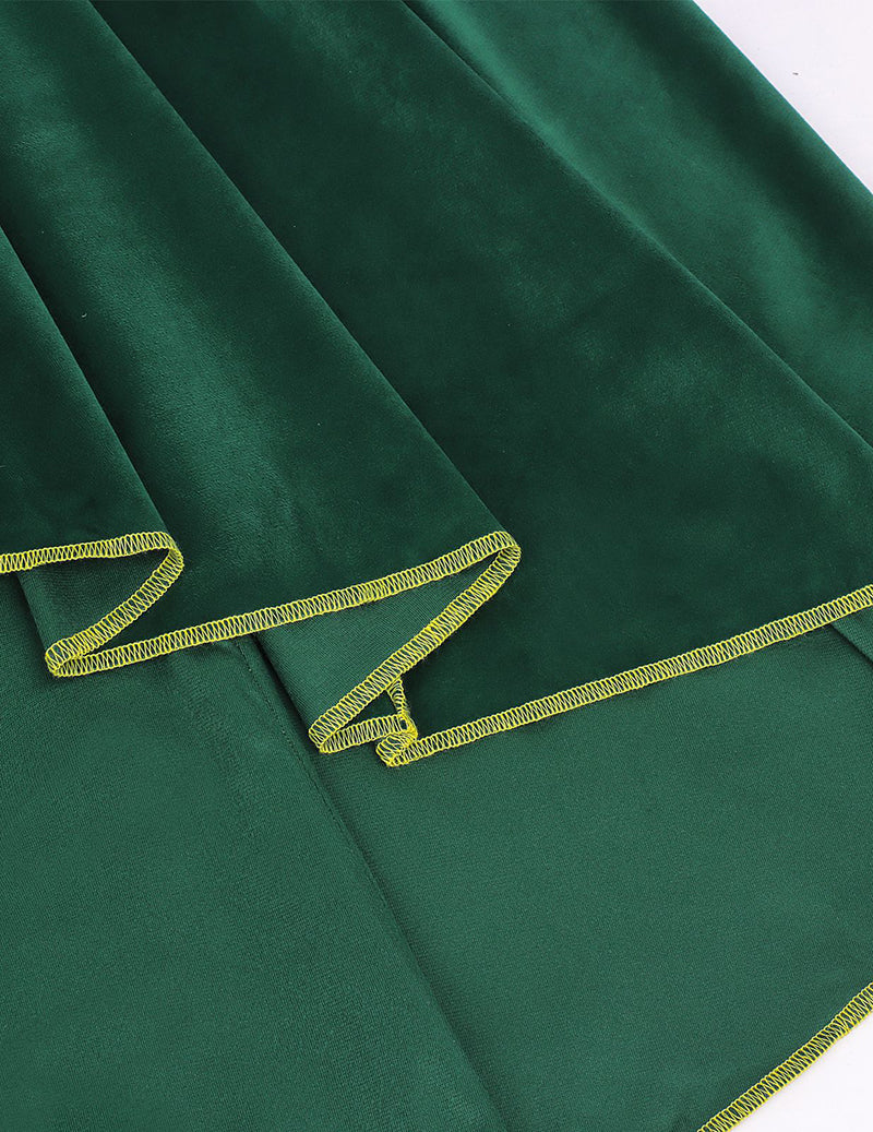Green velvet cloak cape showing gold-trimmed hem and angled panel stitching