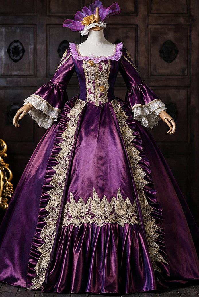 Royal purple medieval court gown on mannequin with ornate gold embroidery and lace cuffs