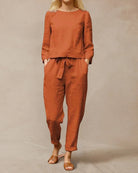 Orange two-piece pants set with long-sleeve top and drawstring waist pants