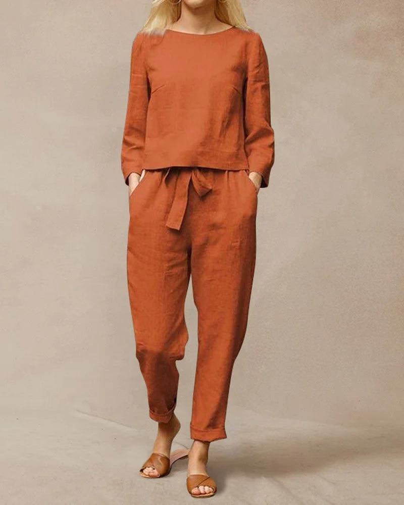 Orange two-piece pants set with long-sleeve top and drawstring waist pants