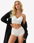 White lace bra and matching lace panties set with thin adjustable shoulder straps