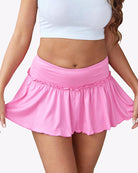 Pink ruffle mini skirt with elastic waistband and gathered, flared hem