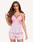 Pink satin pajama set with lace heart camisole and matching lace-trimmed shorts