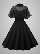 Black midi witch dress with sheer cape sleeves, fitted bodice, flared skirt