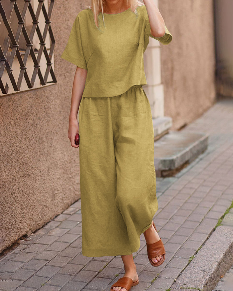 Loose fit two piece set: light green short-sleeve top and wide-leg cropped pants