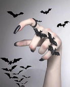 Black bat-shaped adjustable ring with curved band and bat detail accents