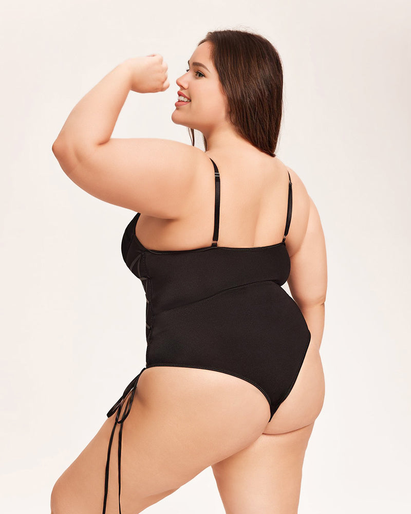 Black tummy control bodysuit with back straps and attached garter belt ties