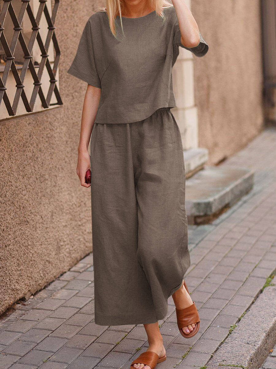 Olive two-piece set with loose T-shirt and wide-leg cropped pants