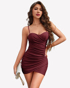 Wine red ruched bodycon mini dress with spaghetti straps and sweetheart neckline.