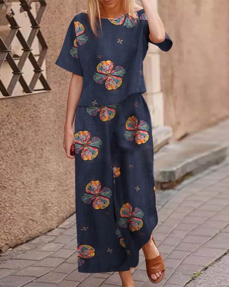 Navy two-piece set with short-sleeve top and matching wide-leg pants, multicolor flower print