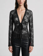 Black sheer lace V-neck tie-front cardigan with long sleeves, scalloped hem