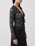 Black sheer floral lace cardigan with deep V tie-front and long sleeves