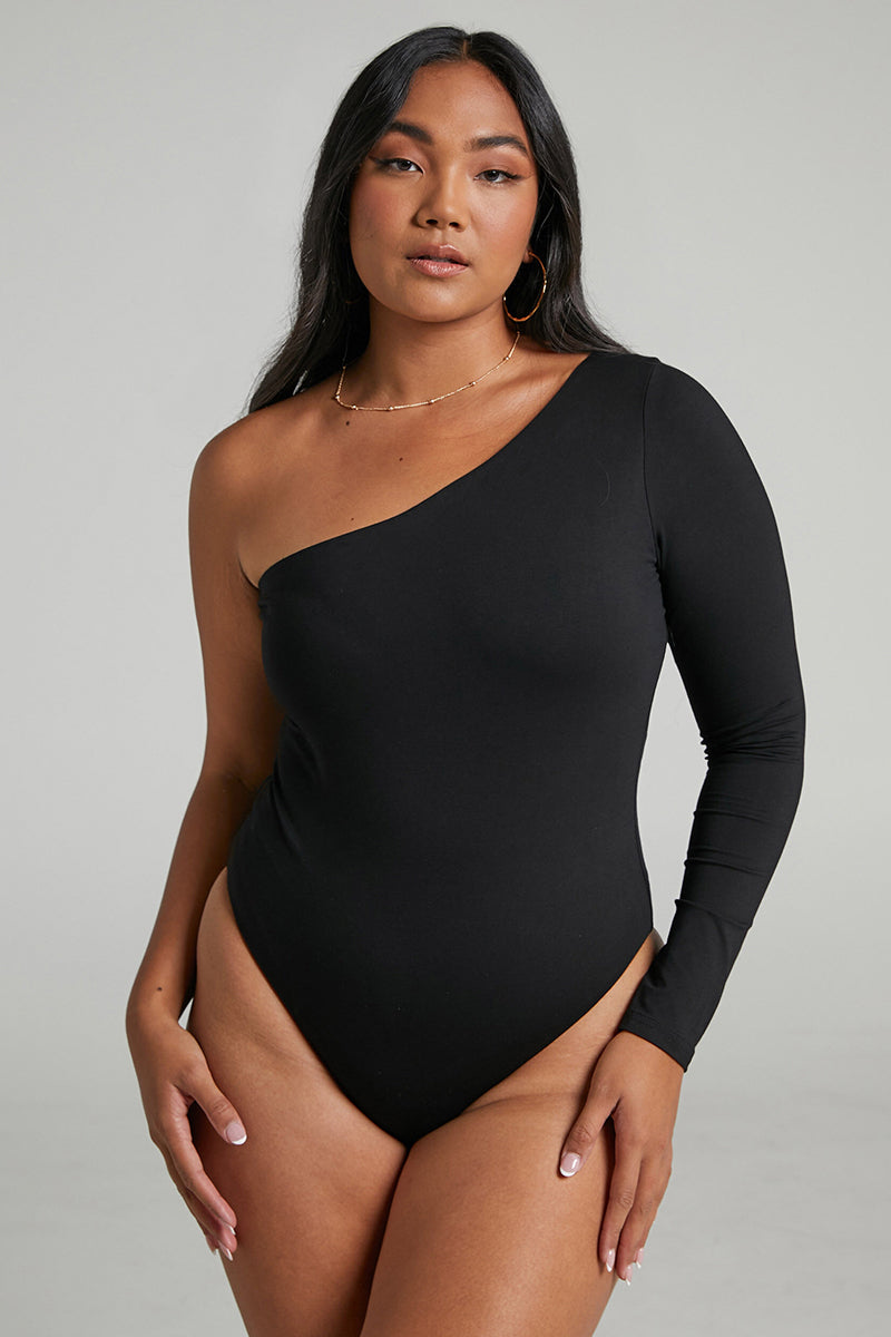 Black one-shoulder bodysuit with long sleeves, fitted stretch knit