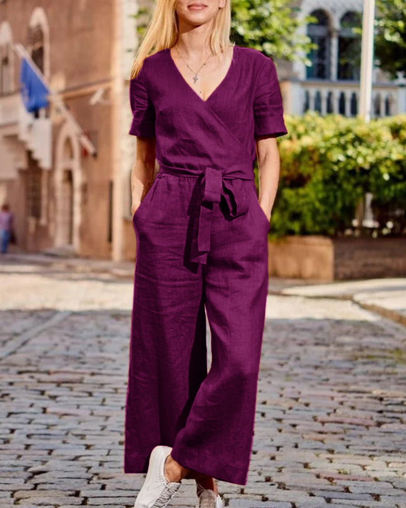 Purple romper jumpsuit with V-neck, short sleeves, waist tie belt, wide-leg pants