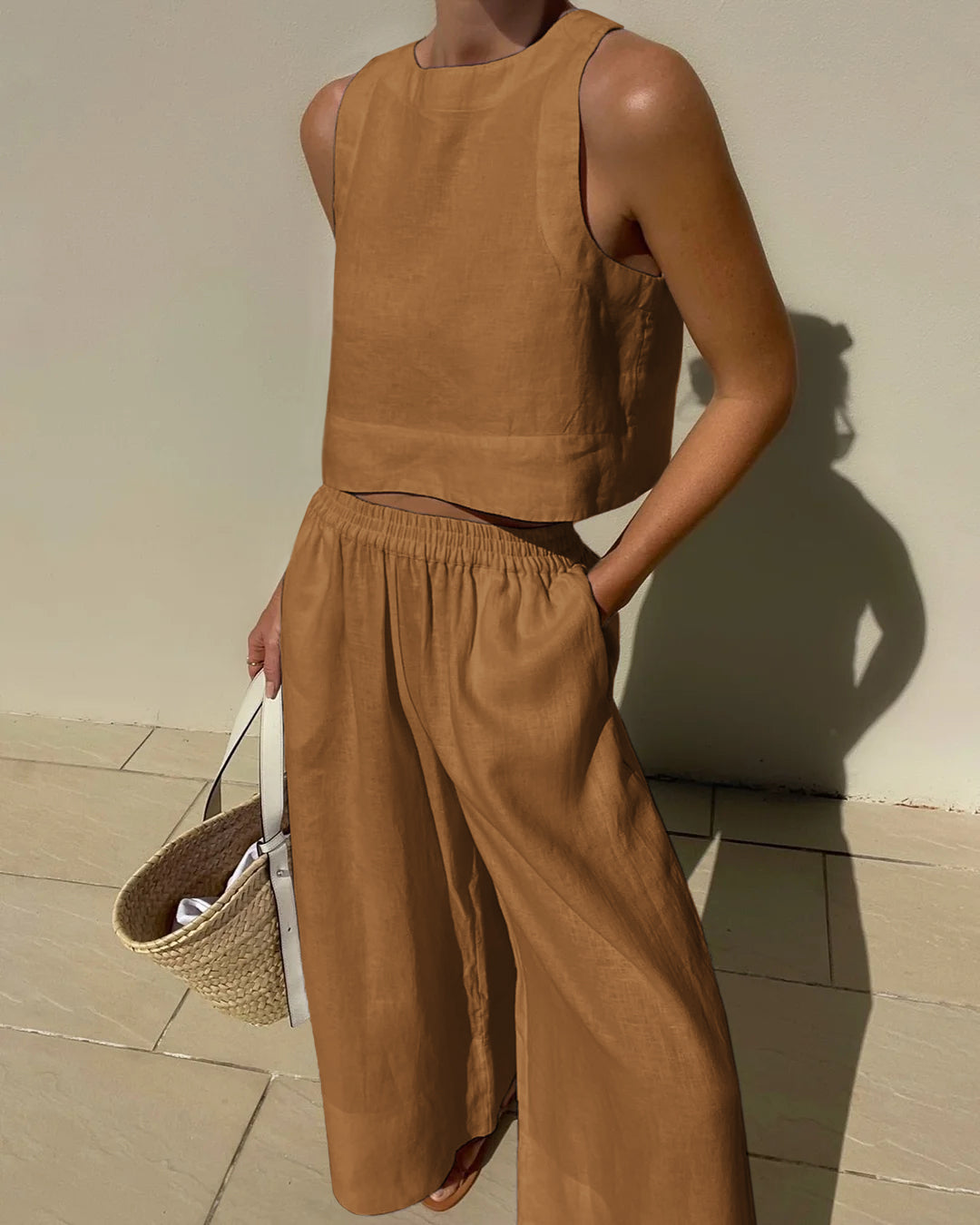 Apricot sleeveless crop top and wide-leg pants set with elastic waist, relaxed wide legs.