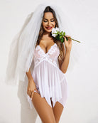 White lace babydoll lingerie with veil, underwire cups, and tie-front, thin straps.