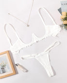 White lace underwire bra and matching panty set, scalloped trim and lace cups