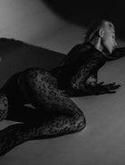 Fishnet bodysuit with long sleeves and full-leg mesh, dark lace pattern