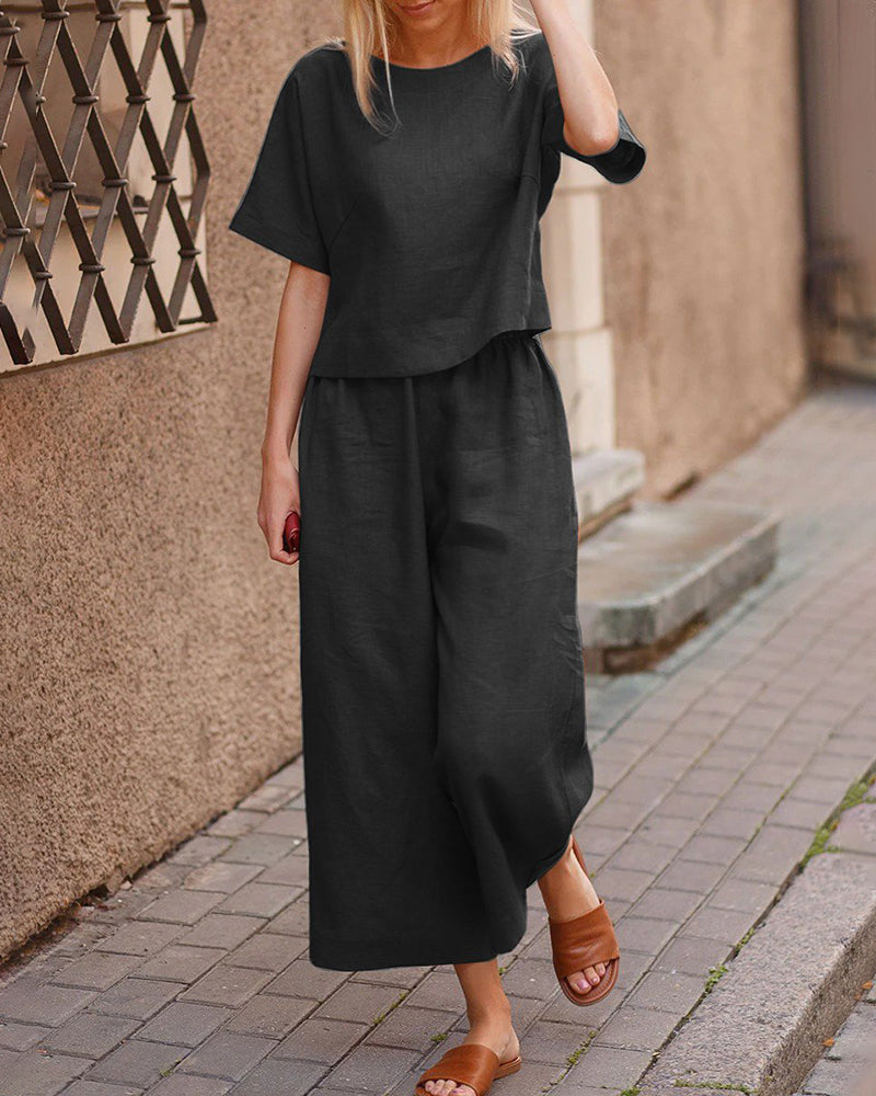 Black two-piece set with loose T-shirt and wide-leg pants