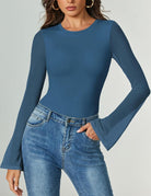 Long-sleeve bodysuit in medium blue with flared sleeves and thong bottom