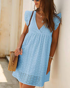 Sky blue lace dress with V-neck and ruffled cap sleeves, eyelet pattern, side pockets