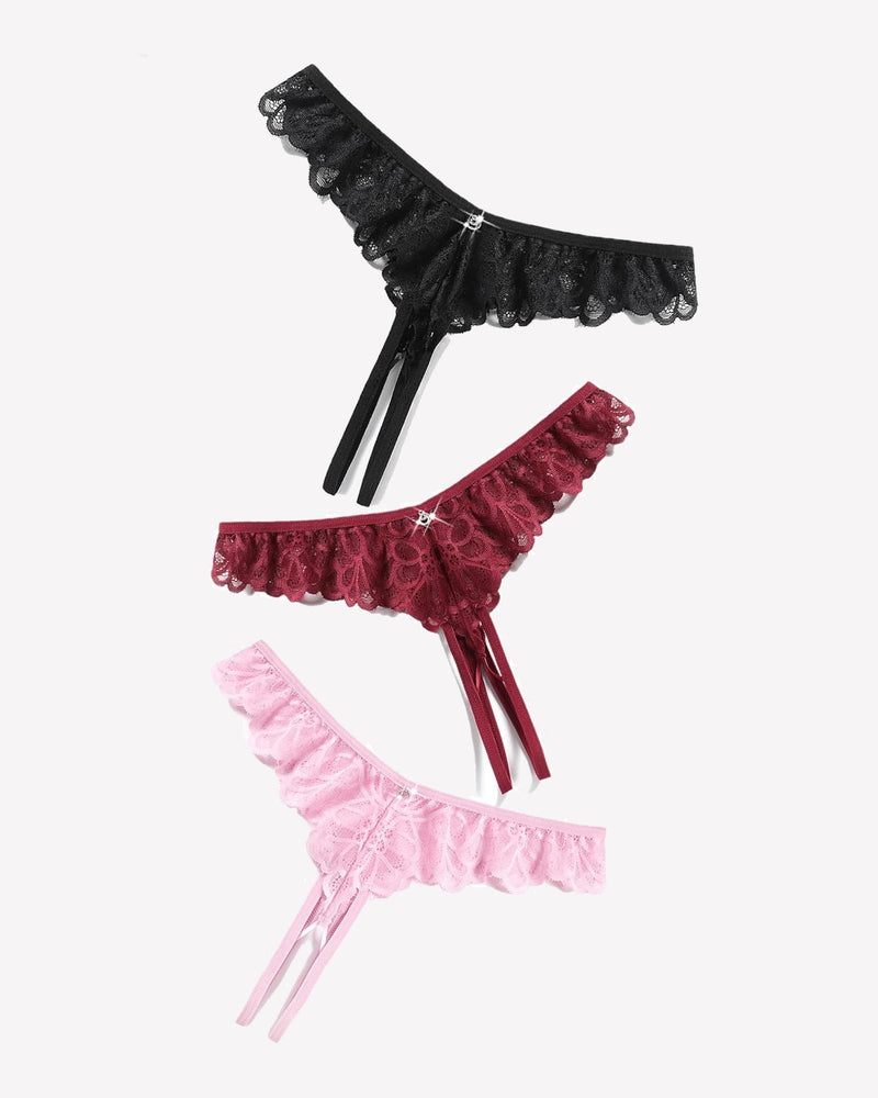 Three lace thong briefs: black, burgundy, and pink with crisscross ribbon ties