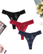 Lace low-rise Brazilian panties in black, red, and navy