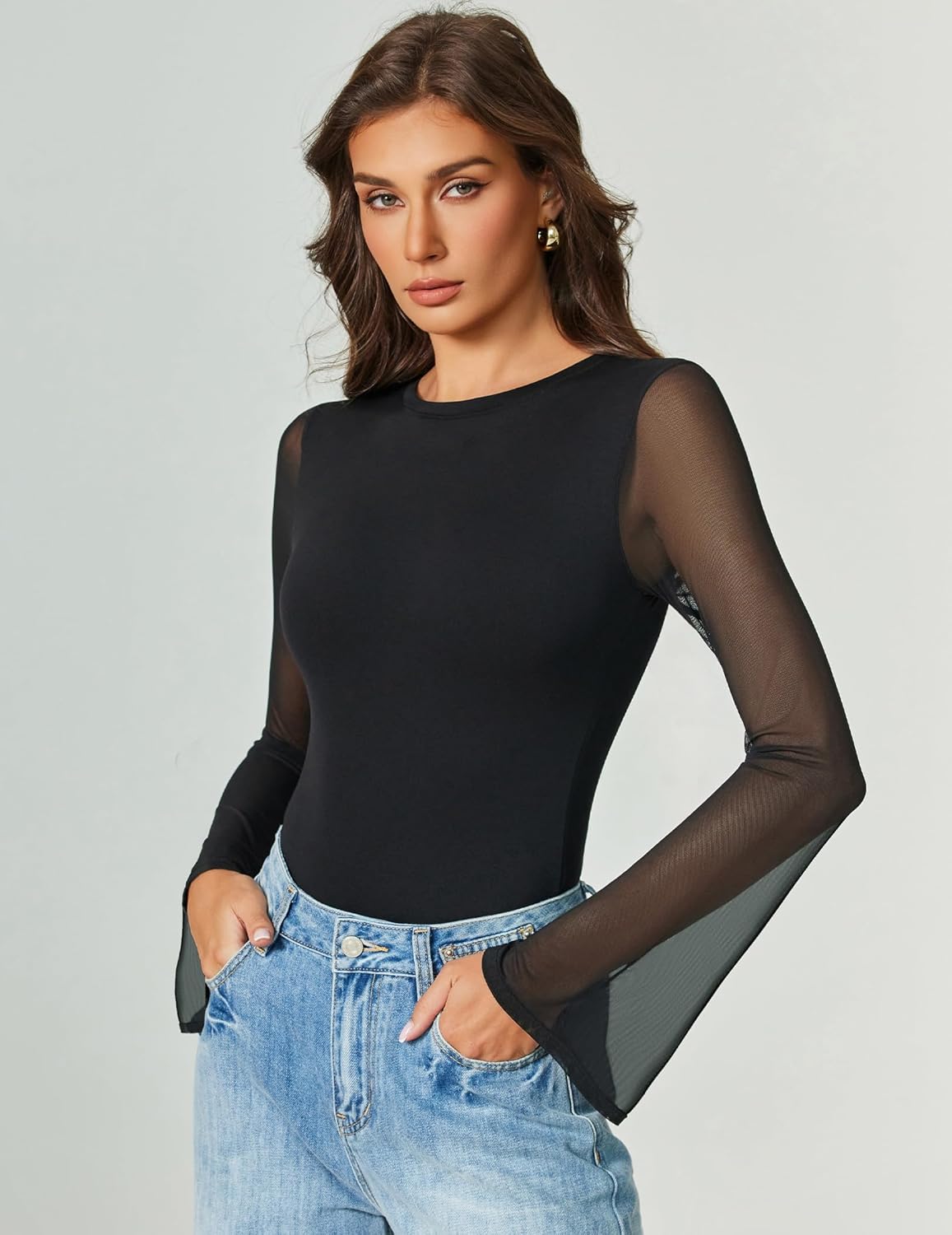 Black mesh long sleeve bodysuit with high-cut leg and smooth round neckline.