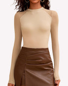 Champagne turtleneck mesh one-piece leotard with long sheer sleeves