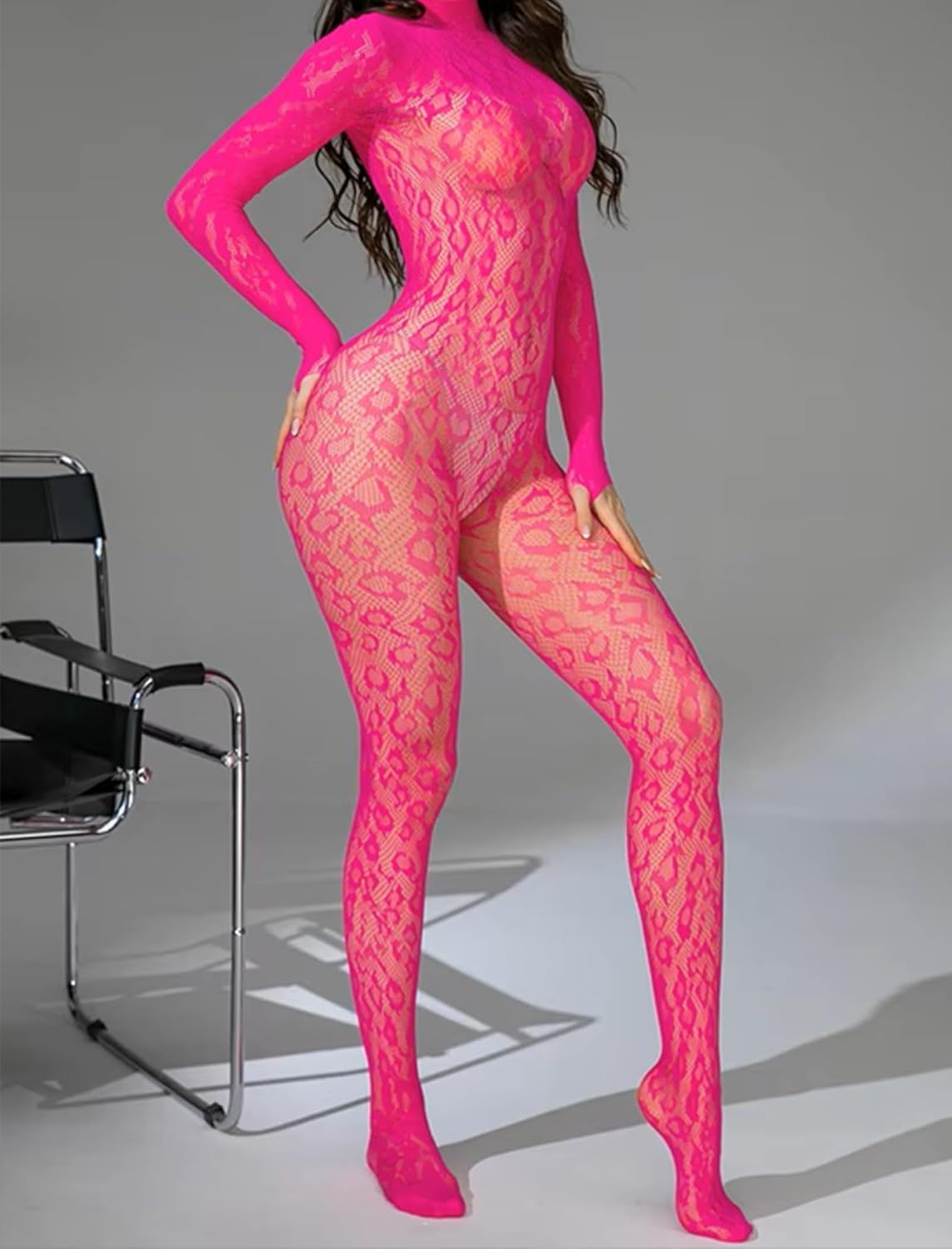 Neon pink fishnet bodysuit with long sleeves and high-cut legs, textured lace pattern