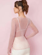 Long-sleeve sheer mesh top in light pink, back view with scalloped neckline trim
