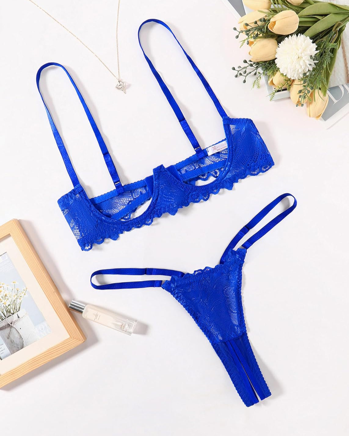 Blue lace underwire bra and matching thong set, scalloped neckline and lace sides
