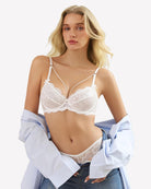 White lace unlined strappy bra with underwire cups, lace trim, and thin adjustable straps