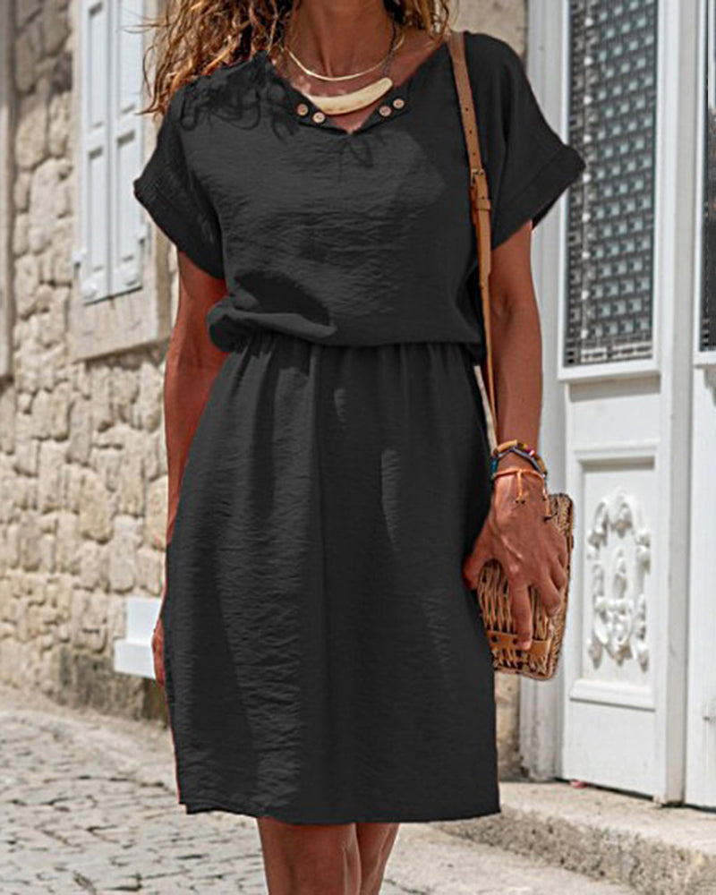 Black mid dress with short sleeves, buttoned V neckline, gathered waist